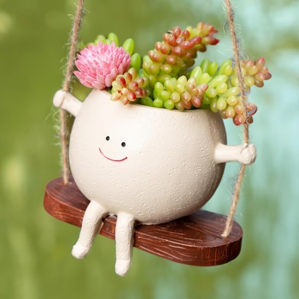 Cvetlični lonček NASMEJANA DEKLICA NA GUGALNICI